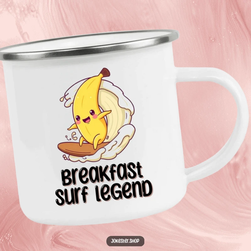 Funny enamel camping mug with a happy banana character surfing on a wave of cream in a rustic setting.