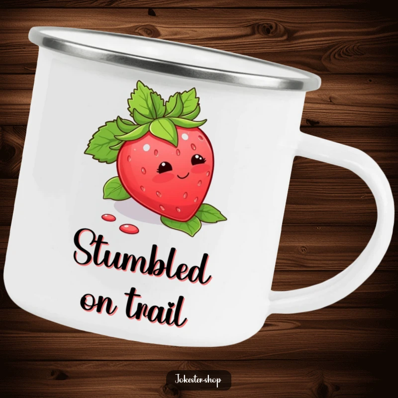Funny Camping Mug showing a blushing strawberry tripping over its leaves, ideal for outdoor sweetness and humor.