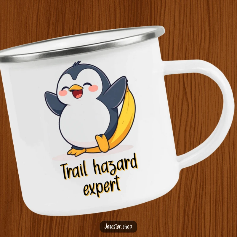Funny enamel camping mug with a plump penguin comically slipping on a bright yellow banana peel.