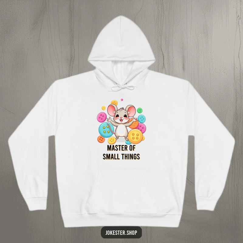 Funny mouse character expertly juggling a rainbow of large buttons, radiating happiness. A warm and funny hoodie for creative comfort.