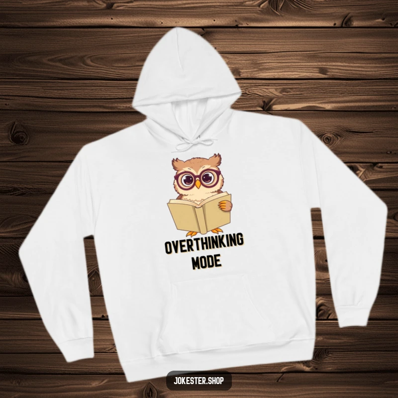 Funny owl character with oversized spectacles, looking perplexed at a massive book, printed on a cozy hoodie.